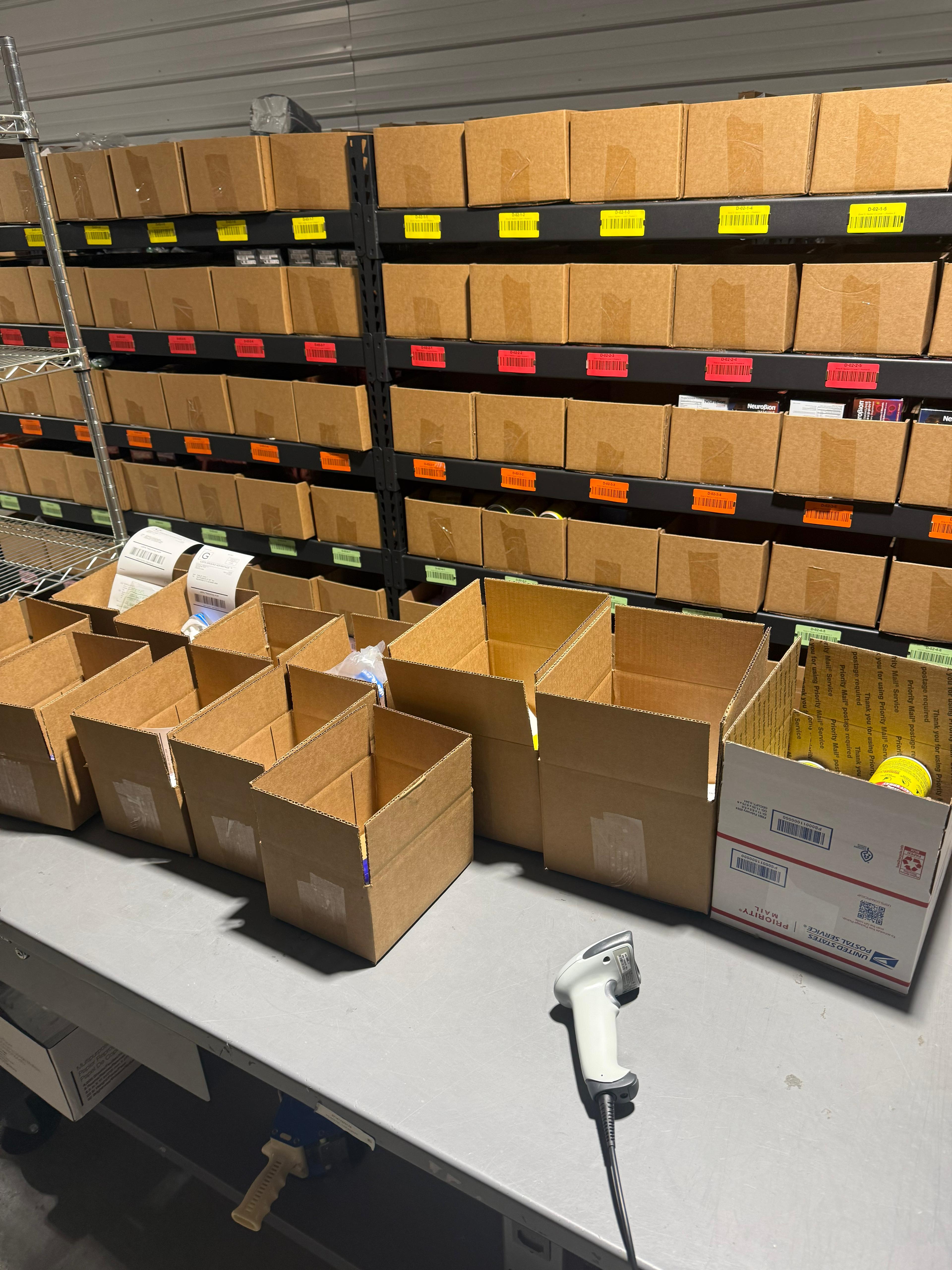 Color-coded shelving system inside 365PrepCenter warehouse